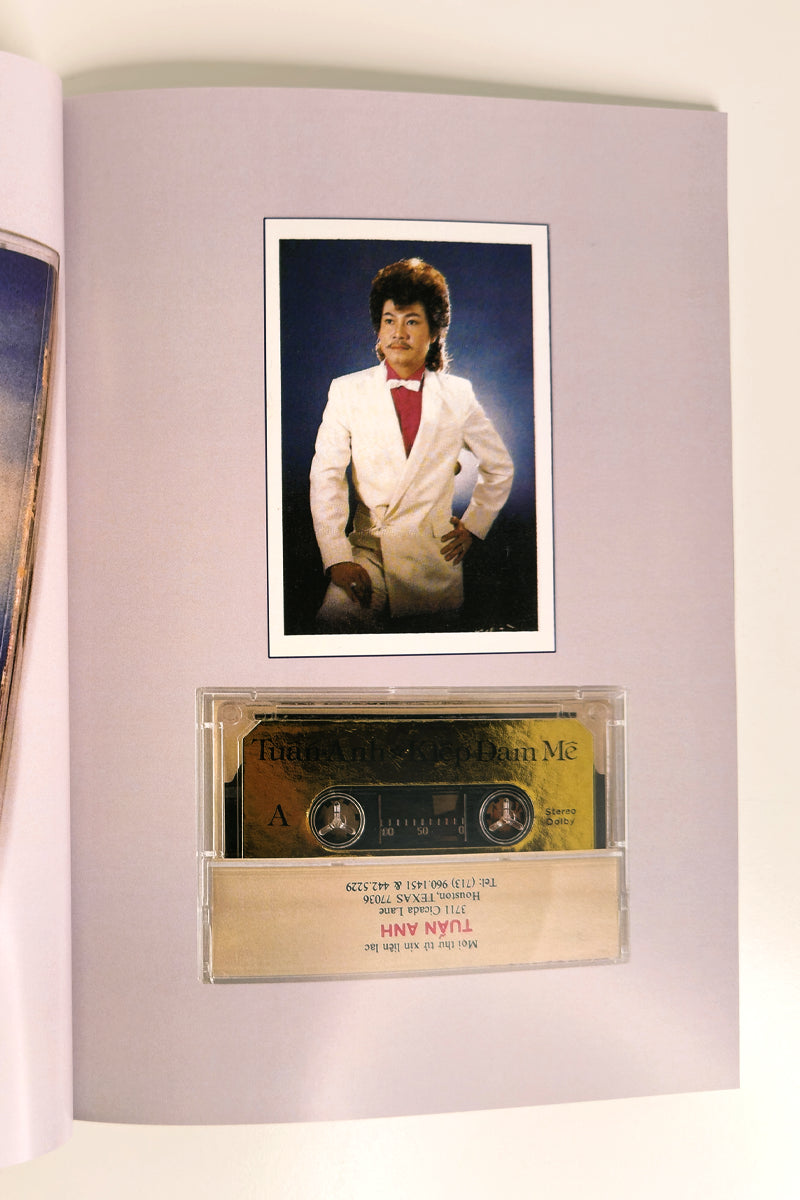 Cassette tape and photo of a person in a white suit on a light gray background